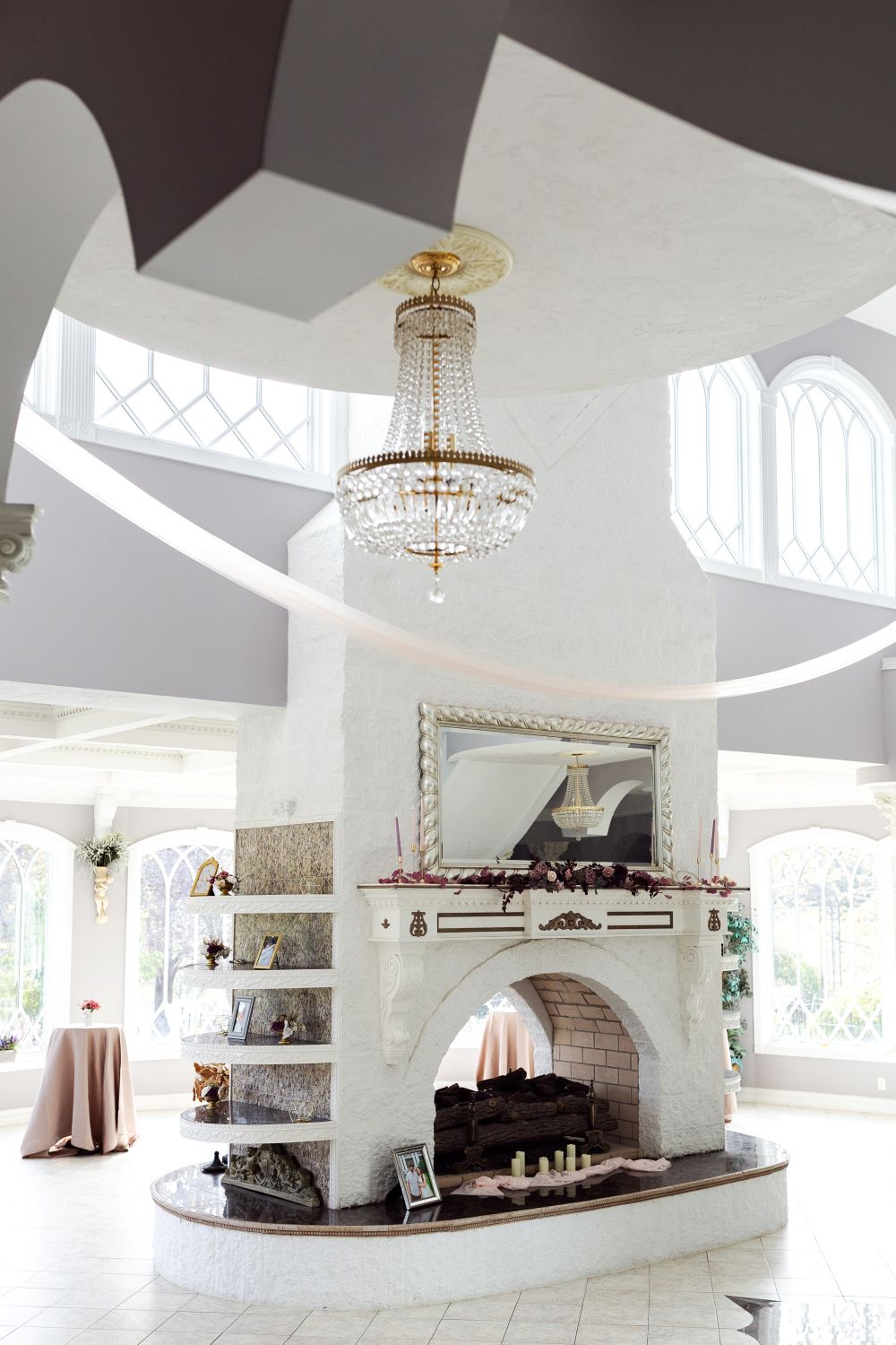 Chandelier and decorative fireplace setup