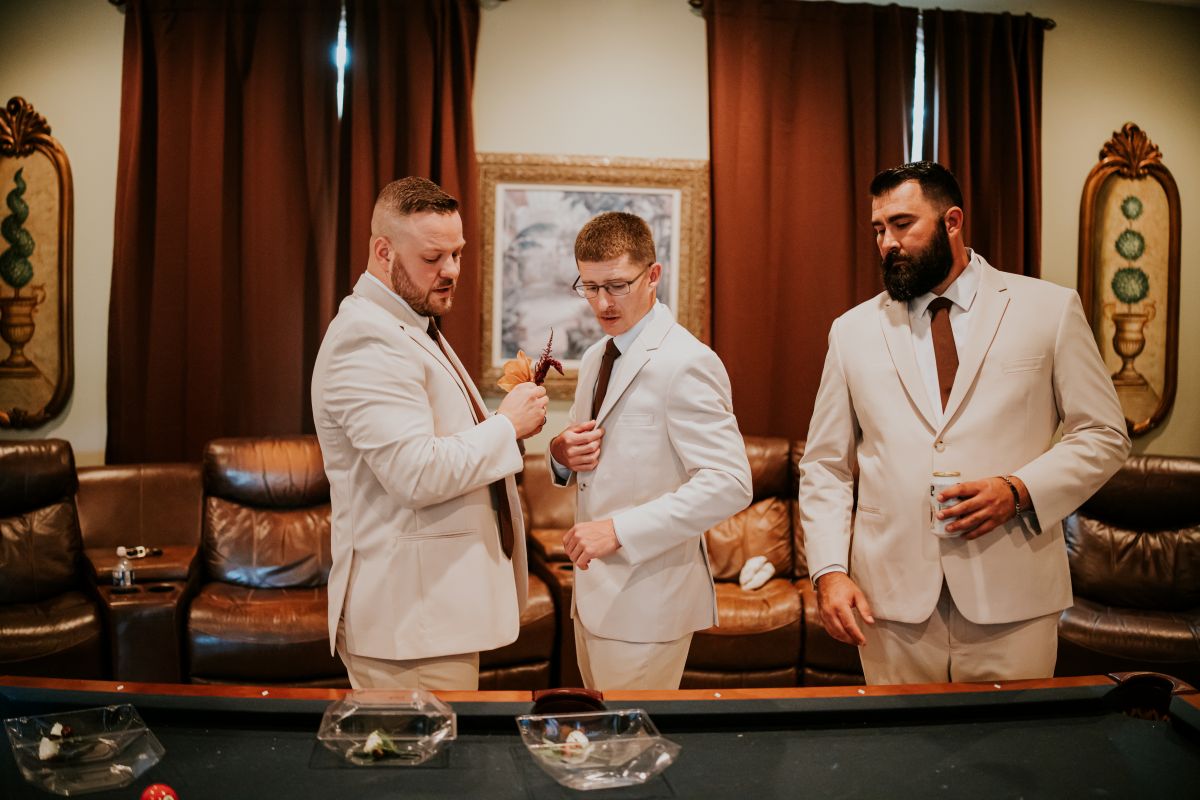 Groomsmen getting ready in the lounge