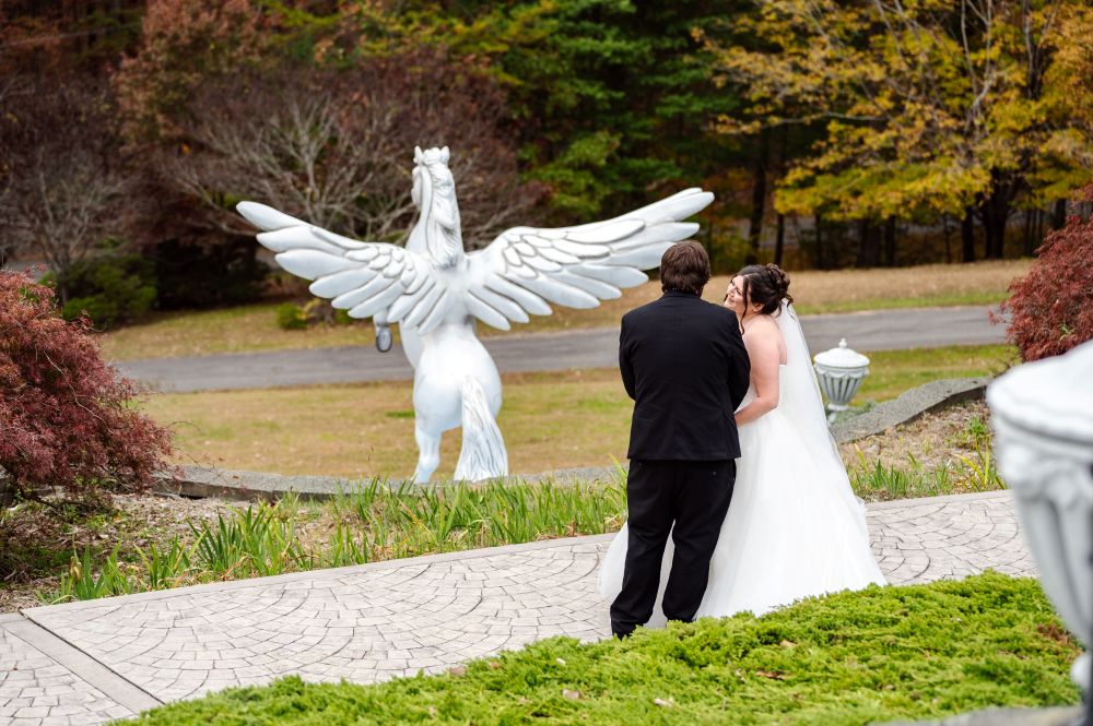 Couple admiring the Pegasus statue
